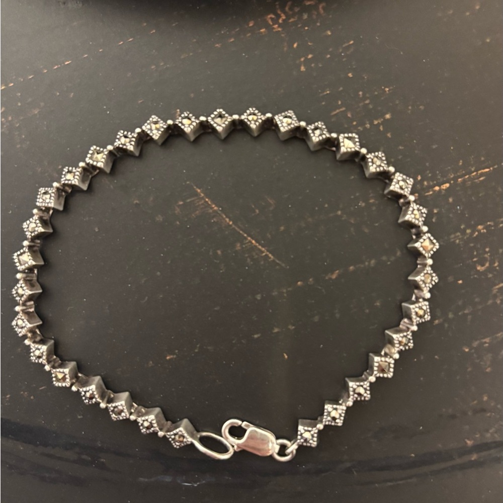 Dazzling Sterling Silver Bracelet with Intricate Detailing. Stamped 925.